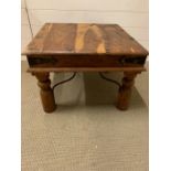 An Indian Hardwood side table with metal stretchers (60 cm sq x 42 cm High)