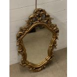 A gilt framed carved mirror