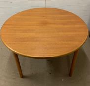 A McIntosh & Co Dining Table with extra leaf.