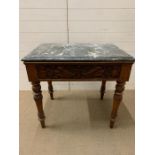 A Marble topped table on turned legs and central drawer with carved detail (H 75 cm x W 84 cm x D 56