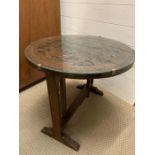 A 1930's Oak tilt top carved Chinese table