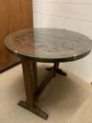 A 1930's Oak tilt top carved Chinese table