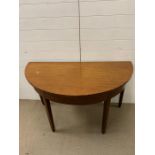 A half moon mahogany occasional table