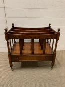 A mahogany Canterbury magazine rack on brass castors and dummy drawer