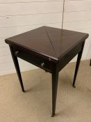 A cherry wood card table