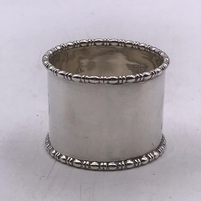 A small selection of silver items to include two thimbles, a napkin ring and fork - Image 2 of 6