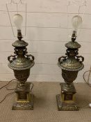 A pair of brass urn table lights