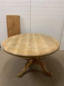 A large extendable pine table with one extra leaf (H77cm W135cm) (leaf 45cm)