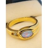 An Australian Opal ring, untested gold metal setting. (Ring size K)