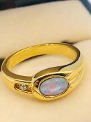 An Australian Opal ring, untested gold metal setting. (Ring size K)