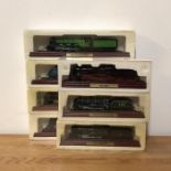 A Selection of seven model trains on plinths