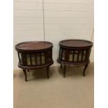 A pair of butler tables with glazed sides and hinged doors both sides (H75cm D47cm W73cm)