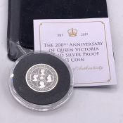 A Sterling Silver Jubilee Mint 20th Anniversary of Queen Victoria £1 coin.