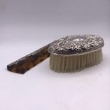 A Ladies silver backed brush and hallmarked silver handled comb.