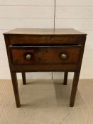 An oak table with drawer to centre and brass handles (H77cm W63cm D41cm)