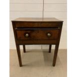 An oak table with drawer to centre and brass handles (H77cm W63cm D41cm)