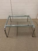 An chrome and glass coffee table (H38cm W84cm D75cm)