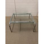 An chrome and glass coffee table (H38cm W84cm D75cm)