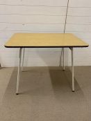 A Mid Century Formica topped table (93 c x 62 cm x 75cm)