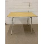 A Mid Century Formica topped table (93 c x 62 cm x 75cm)