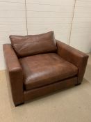 A Berry Club style chair and foot stool (W125cm D106cm H64cm)