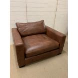 A Berry Club style chair and foot stool (W125cm D106cm H64cm)