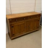 A Light Oak sideboard (147 cm x 50 cm x 88 cm)