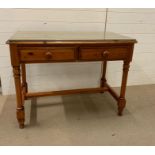 A pine desk with two drawers and a glass top 100cm L x 58cm D x 78cm H