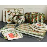 A selection of Pomonia Portmeirion place settings, trays and napkins