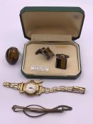 A small selection of jewellery, a rolled gold watch, 9ct gold on silver Gents cuff links, A Tigers
