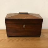 A mahogany tea caddy