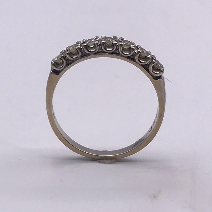 A Round Brilliant cut diamond seven stone half eternity ring, white claw set U0shape settings to a - Image 3 of 4