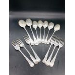 A selection of hallmarked silver spoons and forks (1000g)