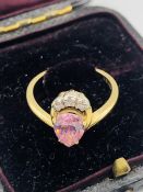 A 14 ct gold ring with heart shaped pink stone