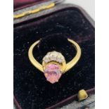 A 14 ct gold ring with heart shaped pink stone