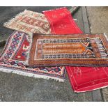 A selection of four pattern rugs to include one runner (180cm x 128cm, 132cm x 87cm, 164cm x 88cm,