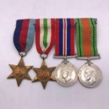 A WWII Medal Bar comprising 1939-1945 Star. Italy Star, Defence Medal, War Medal 1939-1945