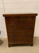 A Bachelors chest with hinged top opening to reveal an extended top