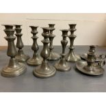 A selection of nine pewter candlesticks to include seven pillar (two pairs) two chamber candlesticks