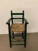 A vintage wooden child's high chair