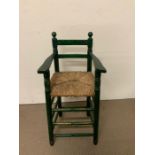 A vintage wooden child's high chair