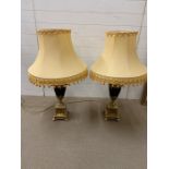 A pair of brass urn table lights