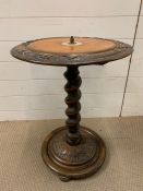 A circular table with carving around the edge on spiral stem (H64cm)