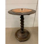 A circular table with carving around the edge on spiral stem (H64cm)