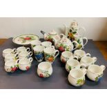 A selection of Pomona Portmeirion china including teapot, mugs, cups and cake stand