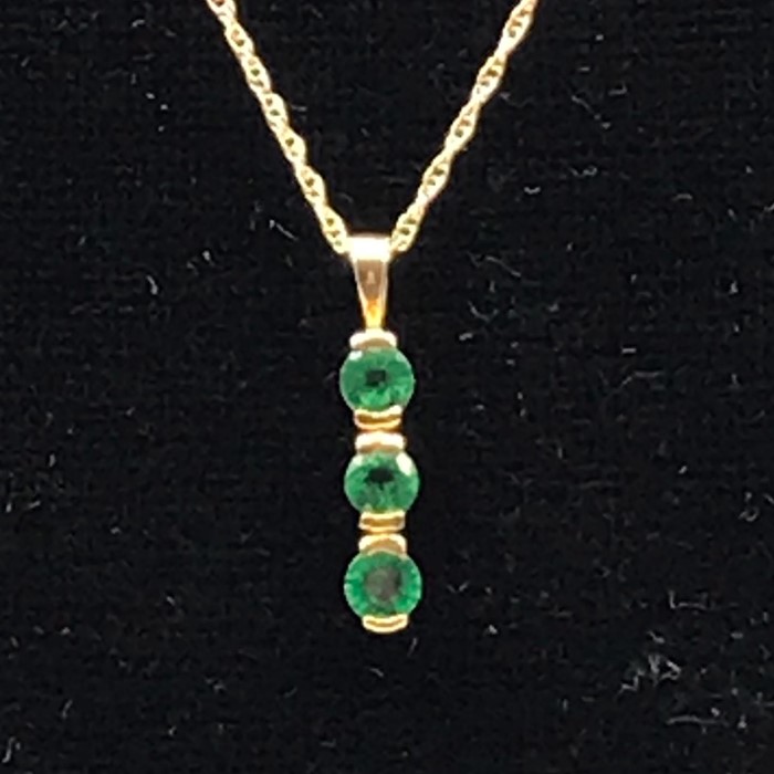 A 9ct gold and emerald three stone pendant with gold neck chain on a bolt ring clasp detailed 375.( - Image 2 of 4