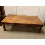 An Indian Hardwood Coffee Table with metal stretchers (W 159 cm x D 89 cm x H 45cm)