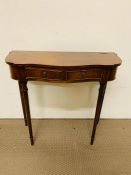 A hall table with drawer to centre on fluted legs (H74cm W80cm D35cm)