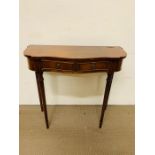 A hall table with drawer to centre on fluted legs (H74cm W80cm D35cm)