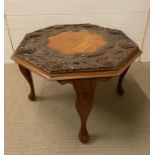 A Carved incidental table (D 66 cm x H 46 cm)